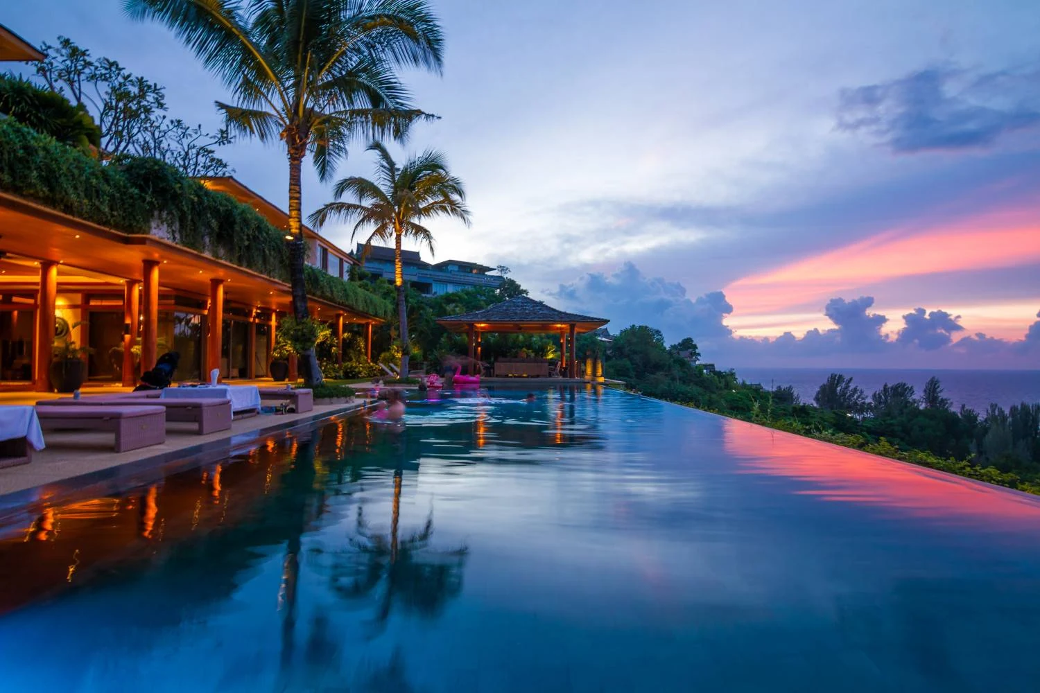 The infinity pool at dusk overlooking the Andaman Sea