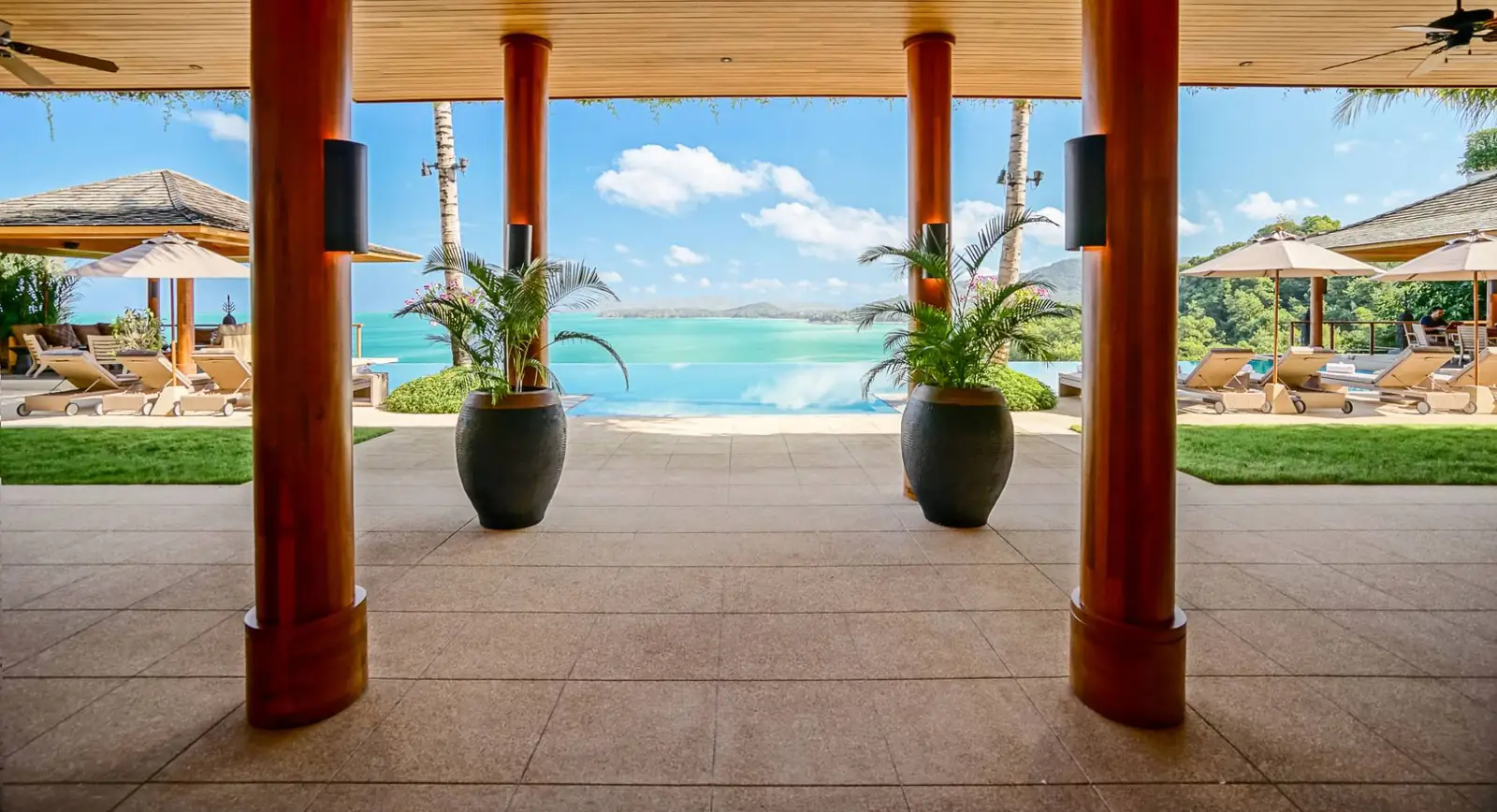 The infinity pool meeting the horizon above Kamala Bay