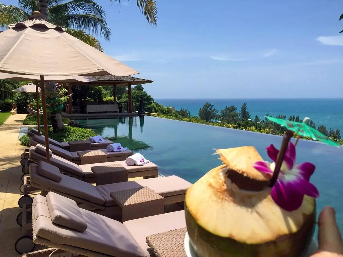 Fresh coconut served poolside overlooking the Andaman Sea