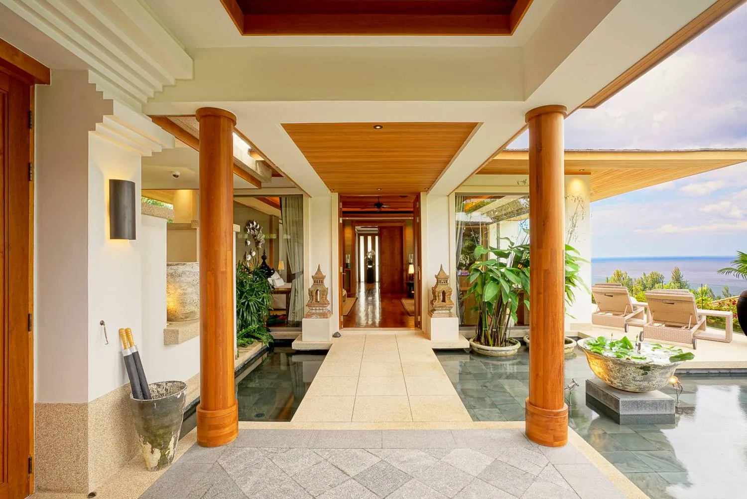 An entrance corridor with timber columns and stone flooring